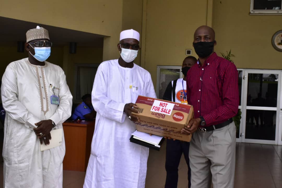 Representatives of Cadbury Nigeria and Price Waterhouse Coopers donate palliatives