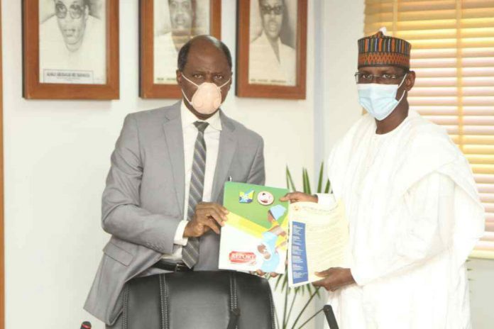 2.President, Society of Gynaecology and Obstetrics of Nigeria (SOGON) Prof Oluwarotimi Akinola presenting a copy of the Maternal and Perinatal Death Surveillance Response Report to the FCT Minister during a courtesy visit by SOGON to the fCTA on 10/09/2020